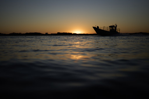 fisherman boat comming back home